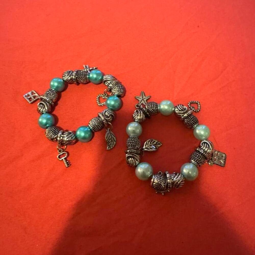 Blue and silver plastic charm bracelet w turquoise beads & silver colored charms